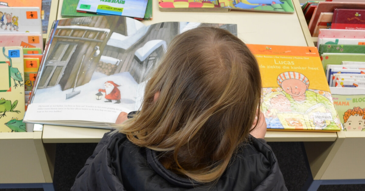 child reading a picture book.