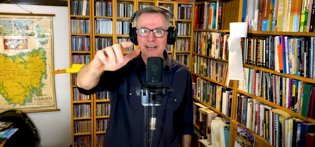 photo depicts colin buchanan singing in the blessing australia video