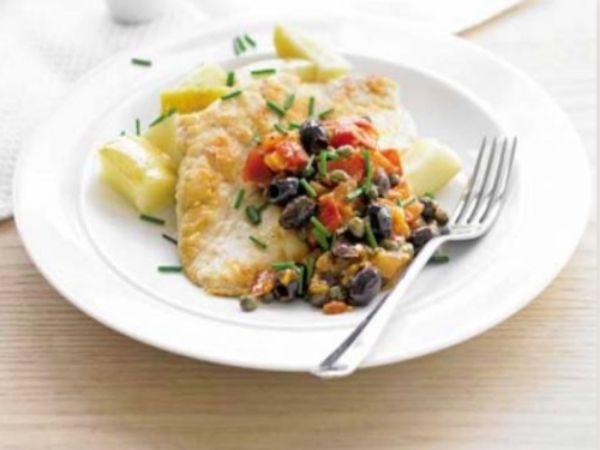 photo shows a plate with chicken, tomatoes and olives