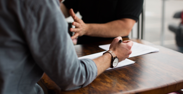 photo of men having a meeting at a cafe