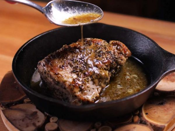 photo shows pork tenderloin in a skillet