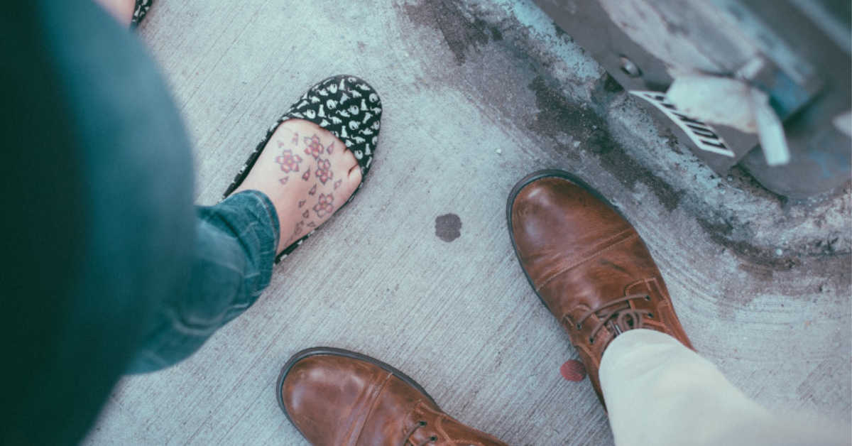 woman and mans feet on pavement